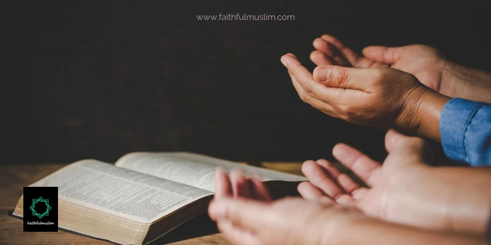 People raising their hands to make dua with Quran in front of them.