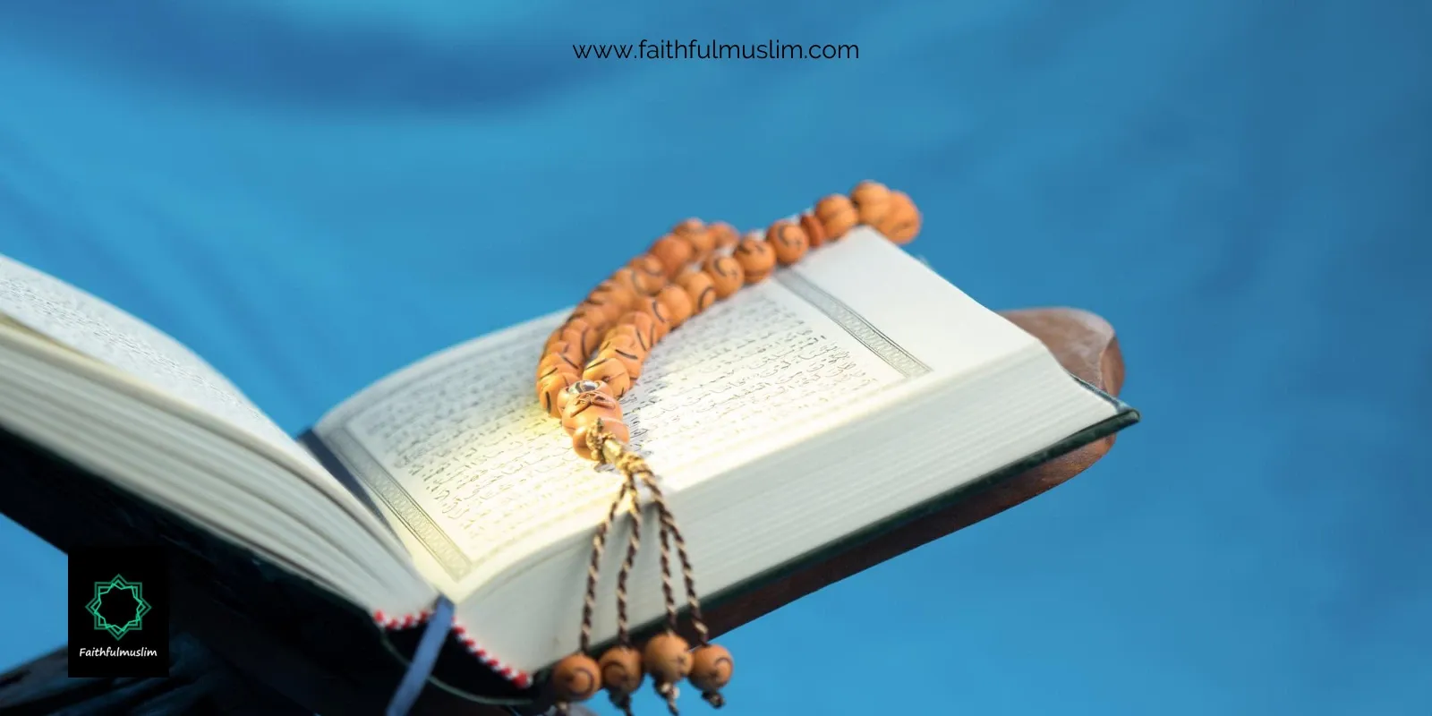 An open Quran on rehel and prayer beads kept on it.