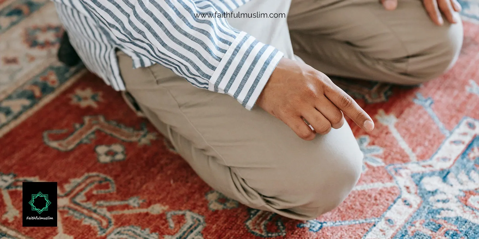 A person praying with his index finger raised.